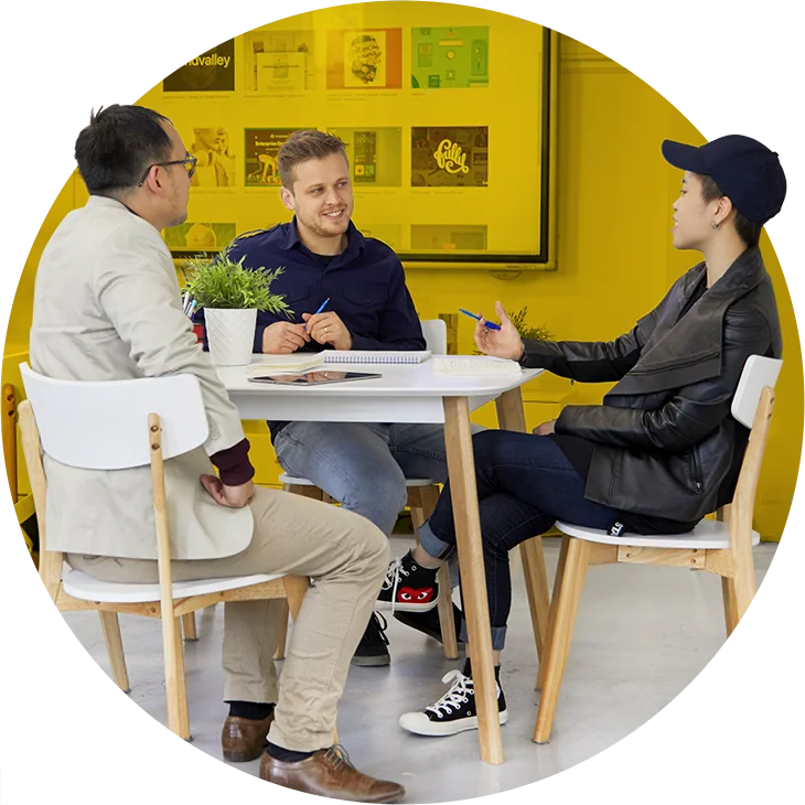 Web design team meeting with a client in a bright Melbourne studio